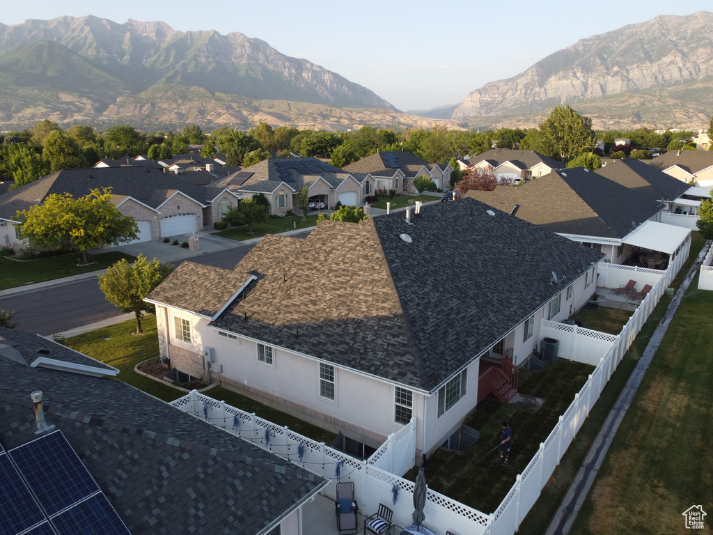 Aerial view of residential area featuring a mountain backdrop