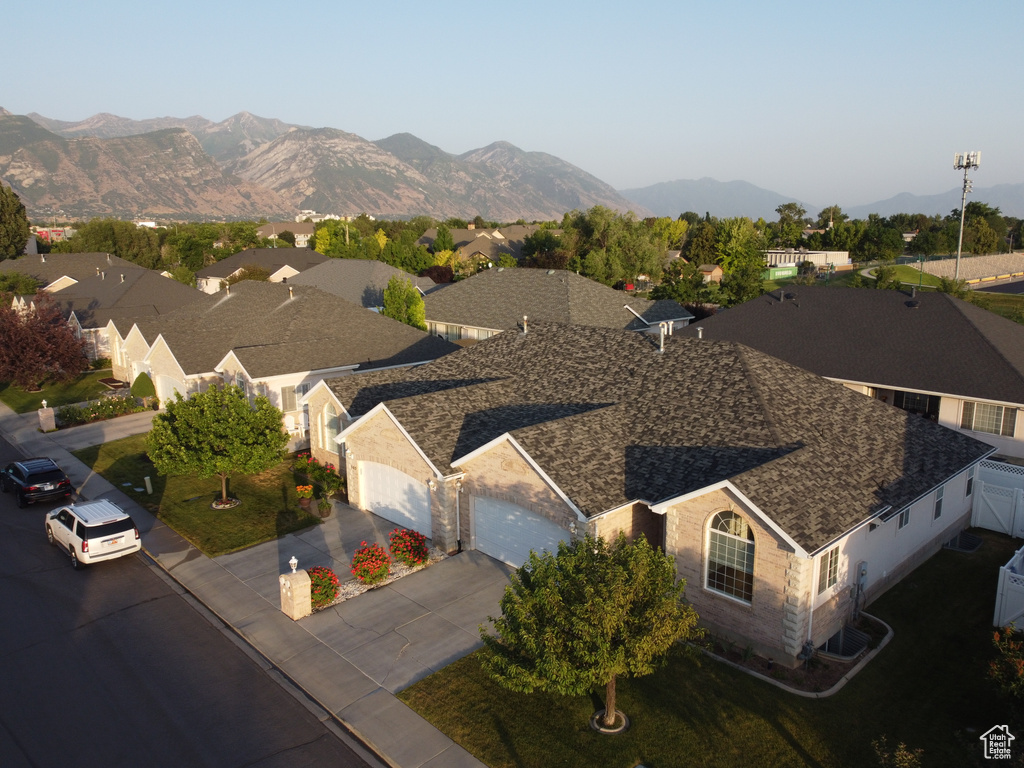 Aerial perspective of suburban area with a mountainous background