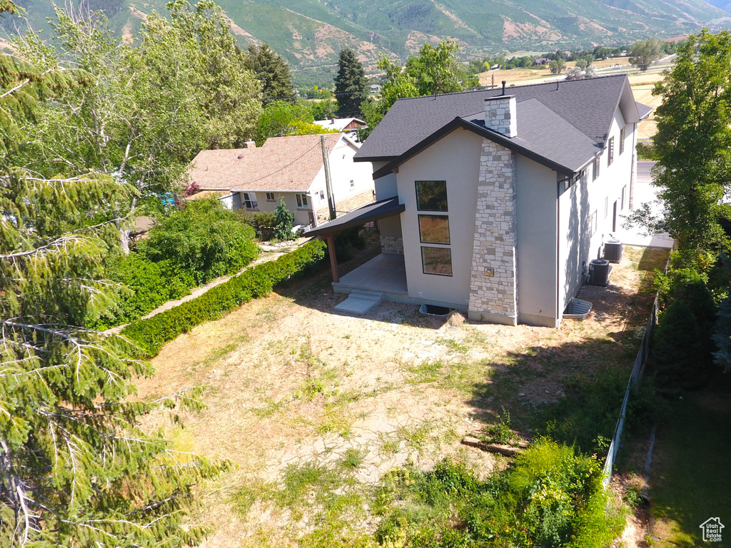 View of subject property with a mountain backdrop