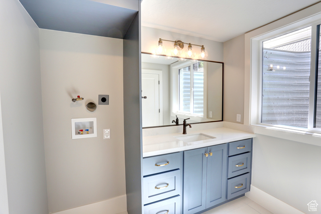 Bathroom with vanity and tile patterned floors