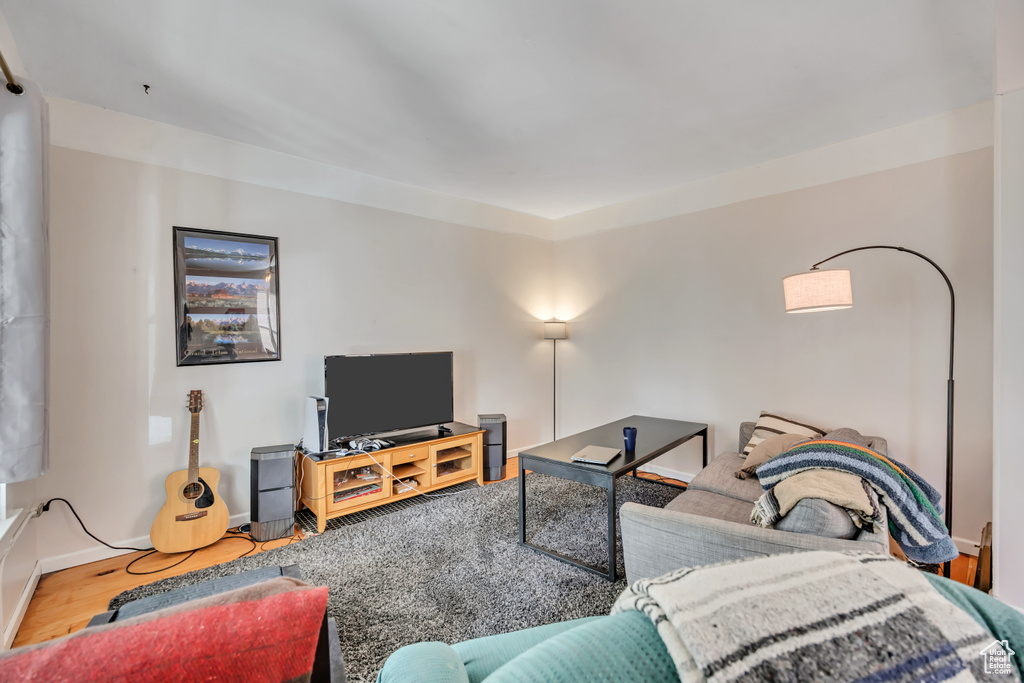 Living room featuring wood finished floors and baseboards
