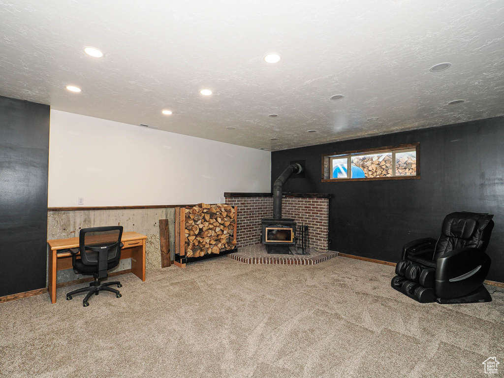 Office area with a wood stove, carpet, and recessed lighting