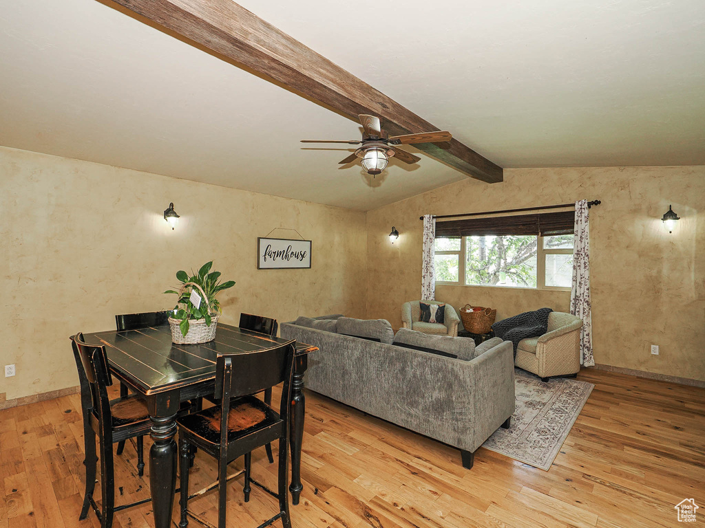 Dining space with light wood-style floors and ceiling fan