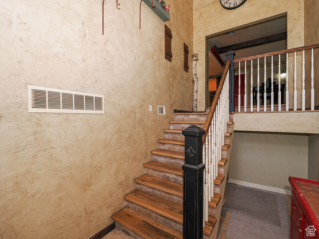 Stairway featuring baseboards