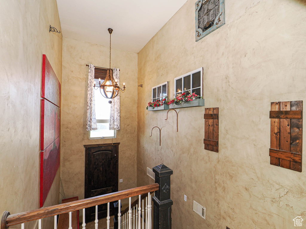Foyer entrance featuring a chandelier