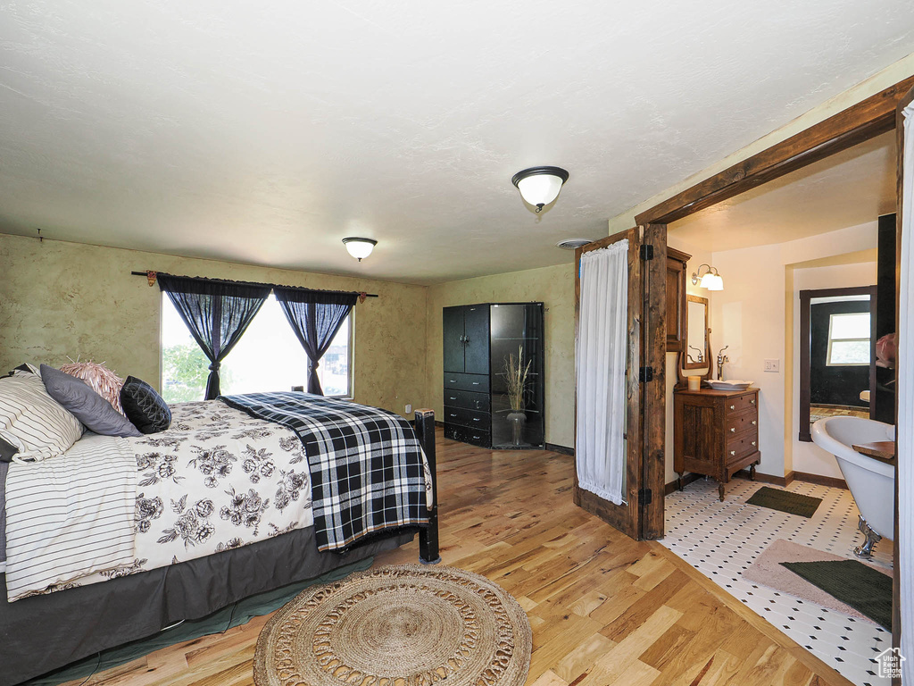 Bedroom with wood finished floors