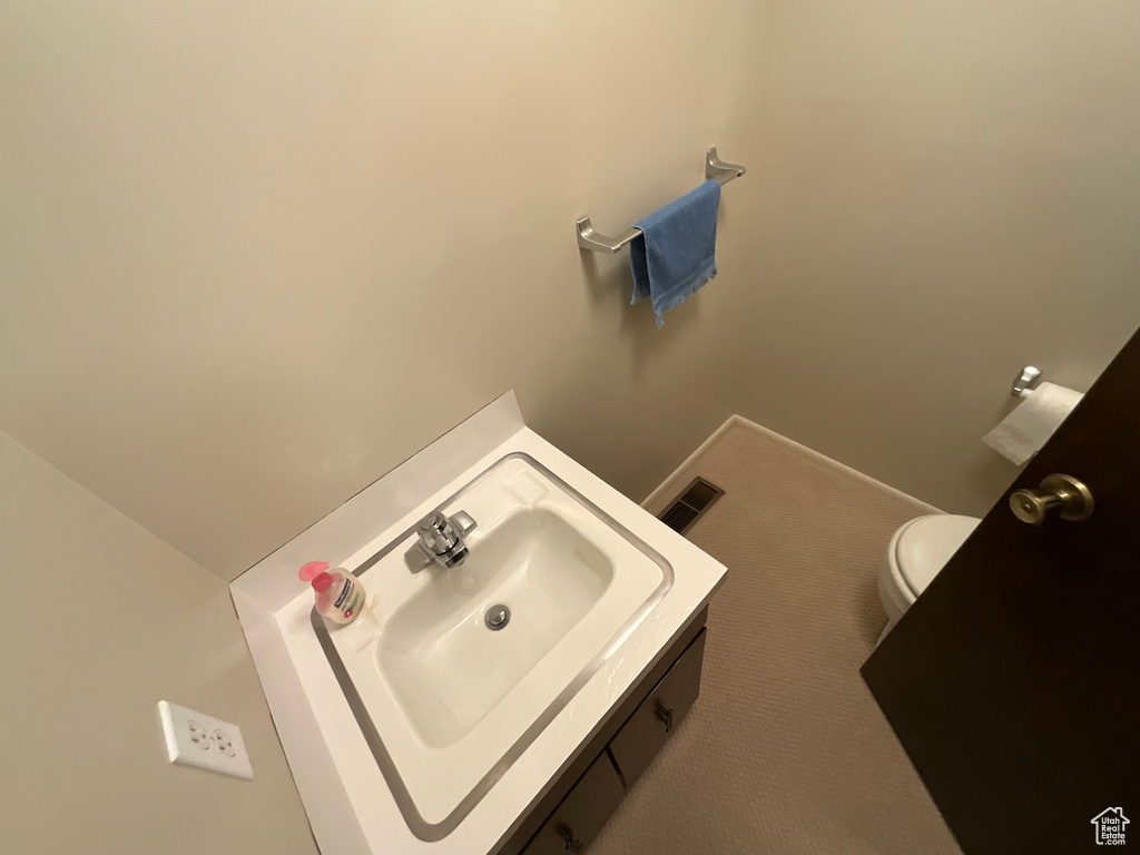 Bathroom with toilet and vanity