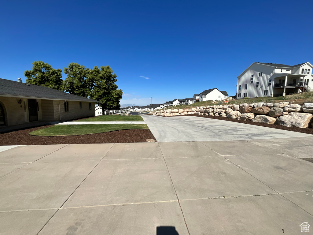 View of concrete surface featuring a residential view
