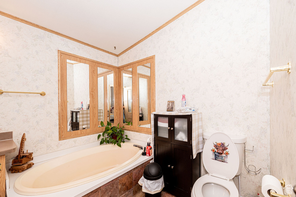 Full bath featuring crown molding, a bath, and wallpapered walls