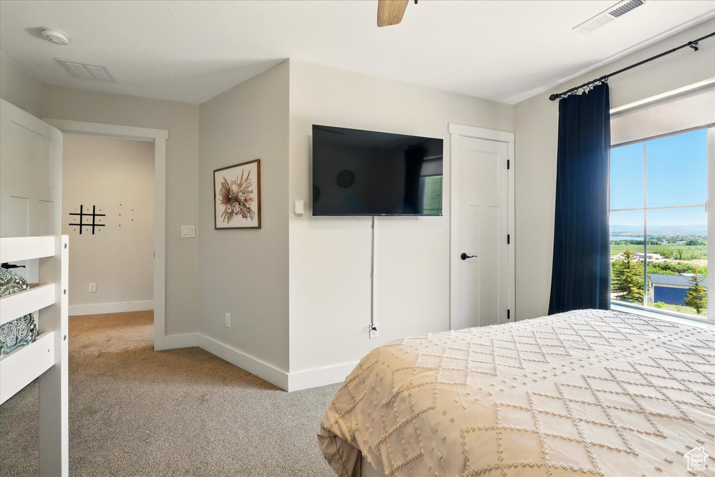 Bedroom featuring carpet flooring and a ceiling fan