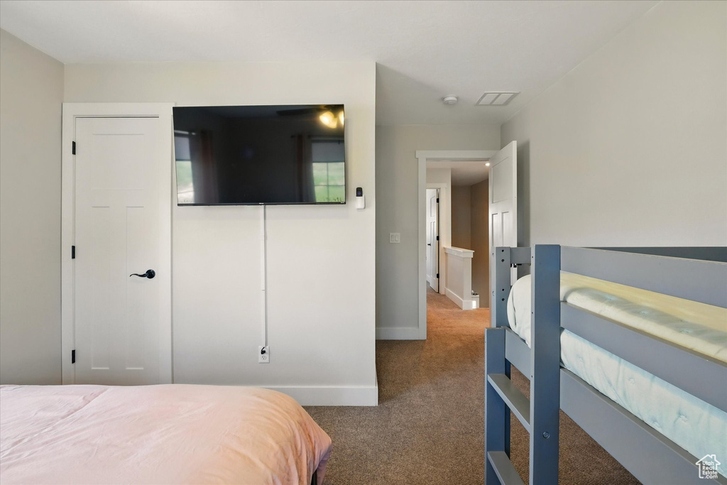 Carpeted bedroom with baseboards