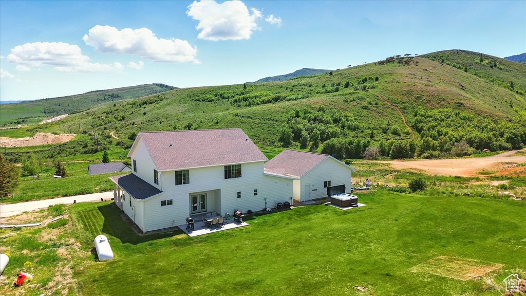 View from above of property featuring a mountainous background