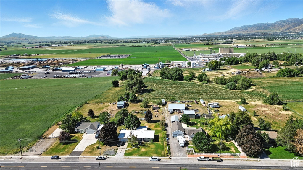 Aerial view of property\'s location featuring a mountainous background and rural landscape