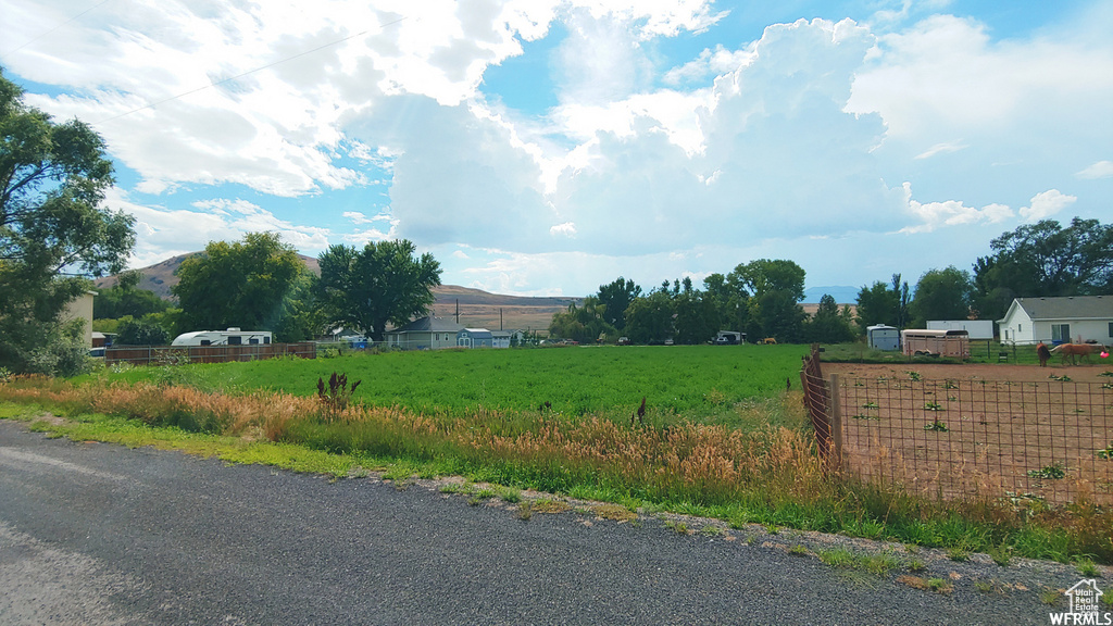 View of asphalt street featuring a rural view