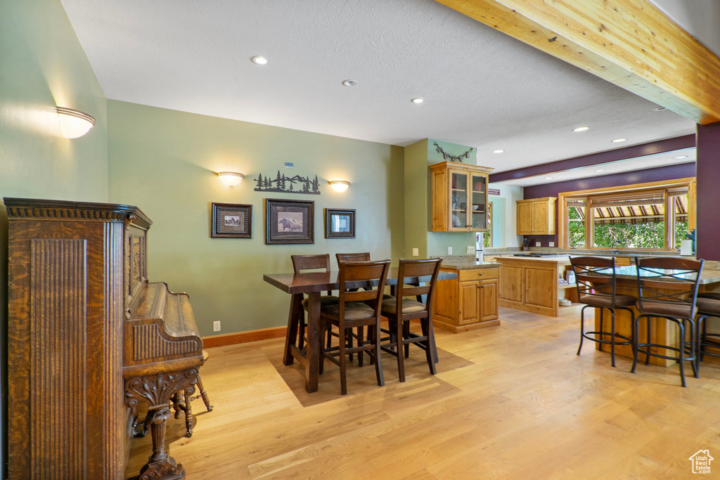 Dining room featuring light wood-style floors and recessed lighting