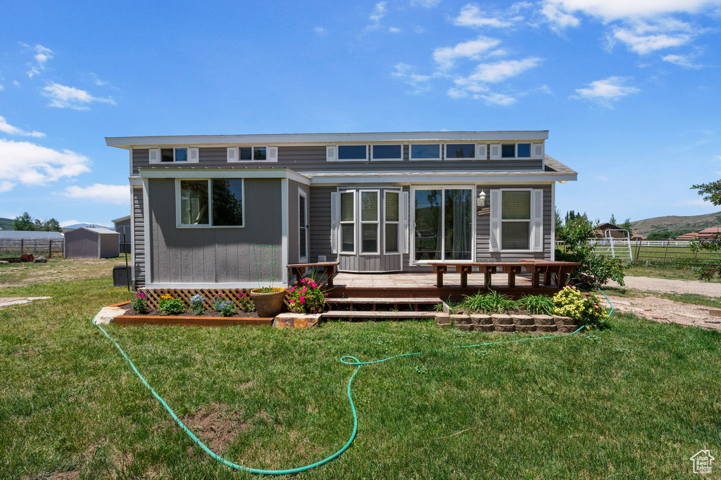 View of front of property featuring a deck