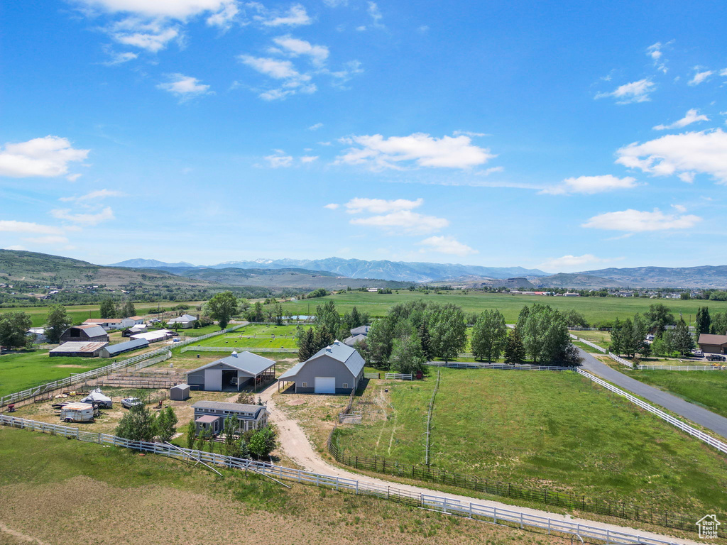 View of rural area featuring mountains and a pastoral area