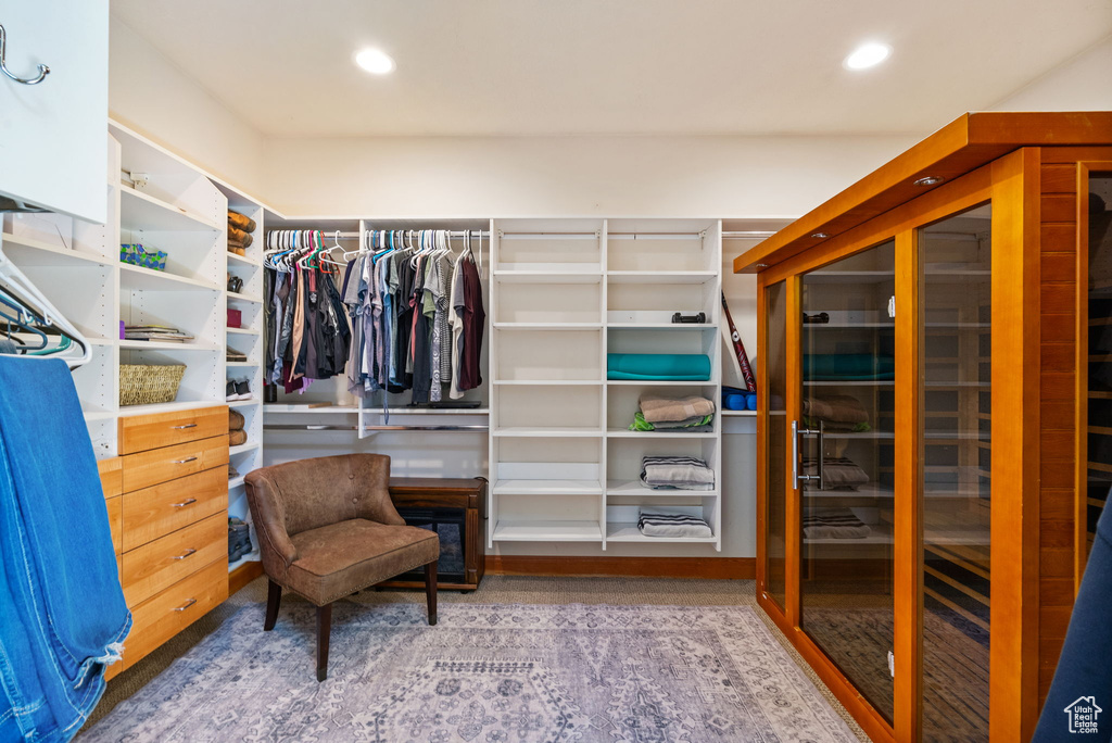 Walk in closet featuring wood finished floors