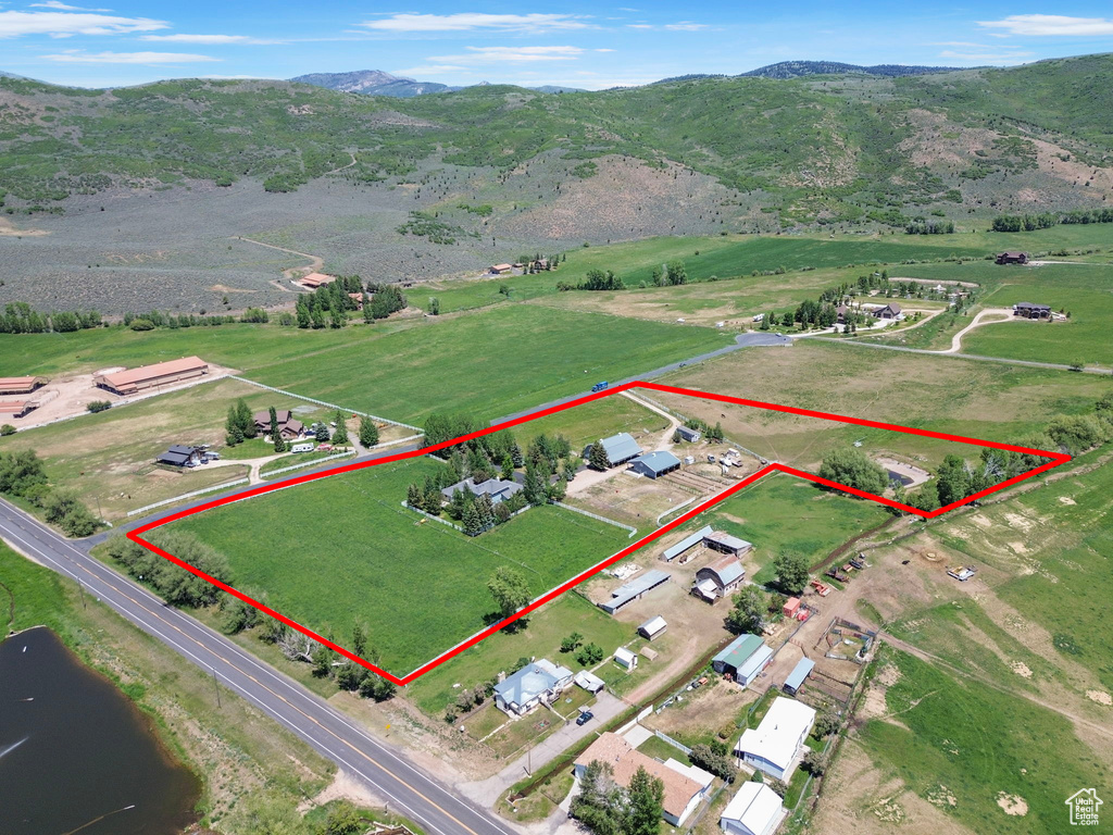 View of rural area with property boundaries highlighted and a mountain backdrop