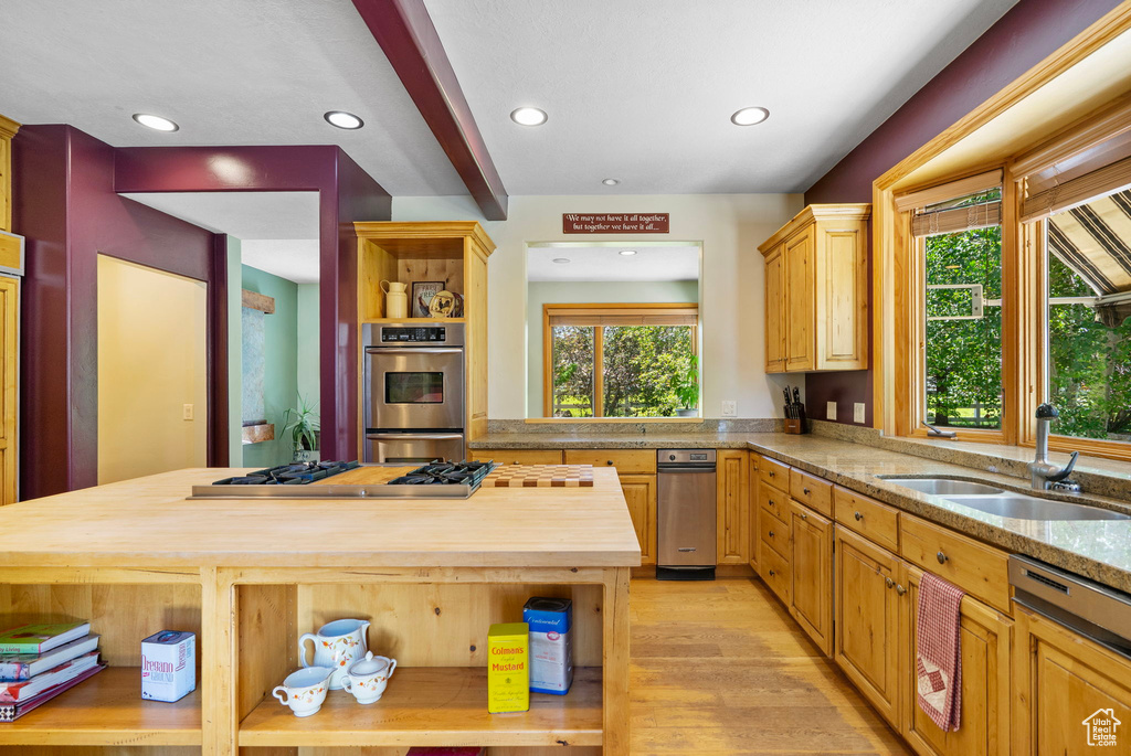 Kitchen featuring open shelves, wooden counters, appliances with stainless steel finishes, light wood-style flooring, and recessed lighting