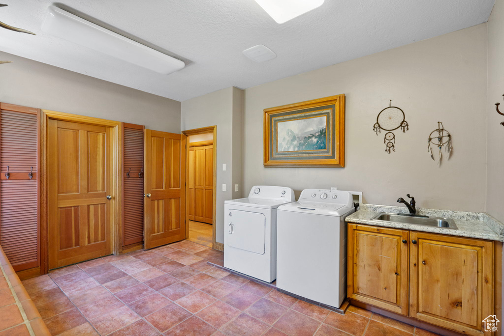 Washroom with cabinet space and washer and dryer