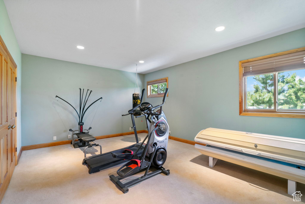 Exercise area with light colored carpet and recessed lighting