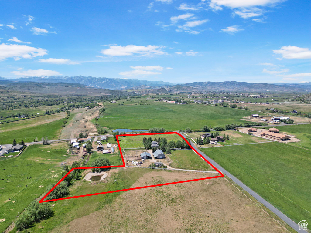 Aerial view of sparsely populated area with mountains and property boundaries highlighted