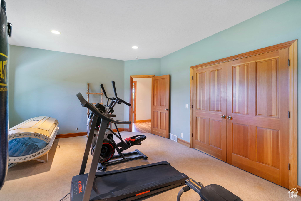 Workout area with carpet and recessed lighting