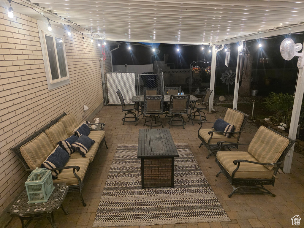 View of patio with outdoor dining area and an outdoor hangout area