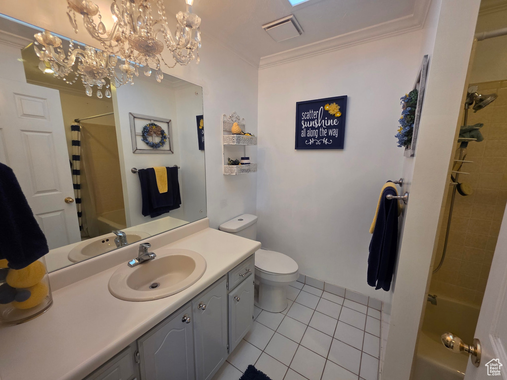 Bathroom with tile patterned flooring, vanity, crown molding, shower / bath combination, and a chandelier