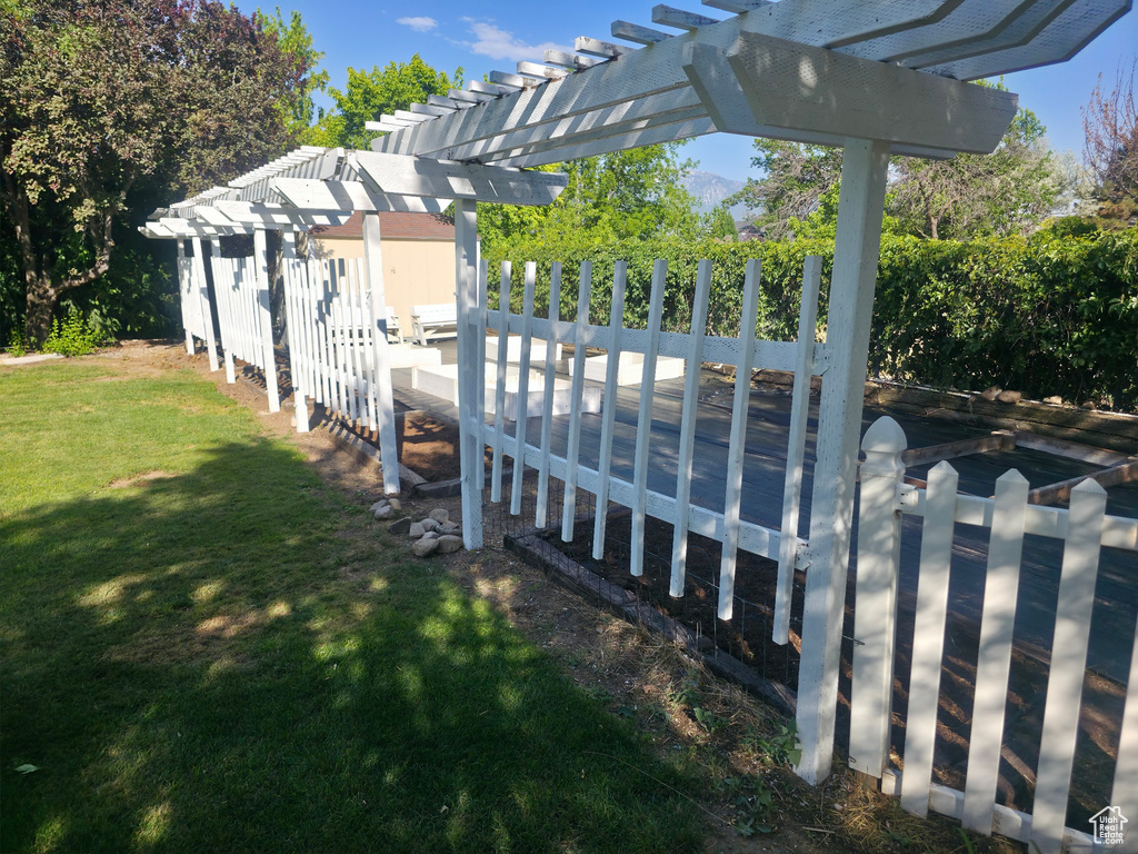 Wooden deck featuring a pergola