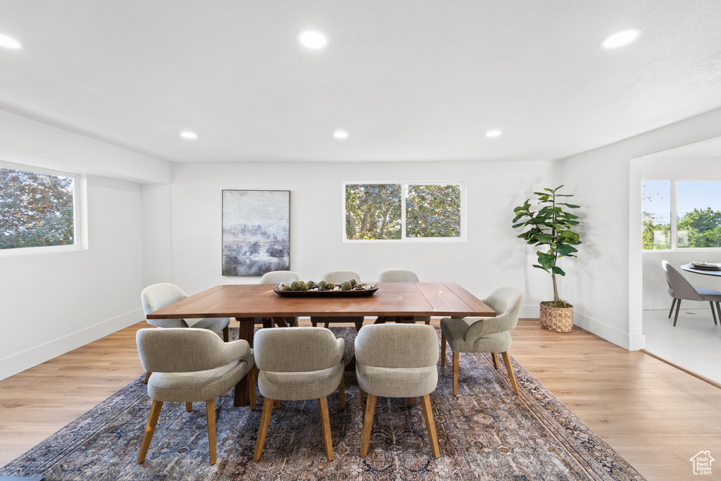 Dining space featuring recessed lighting and light wood-style flooring