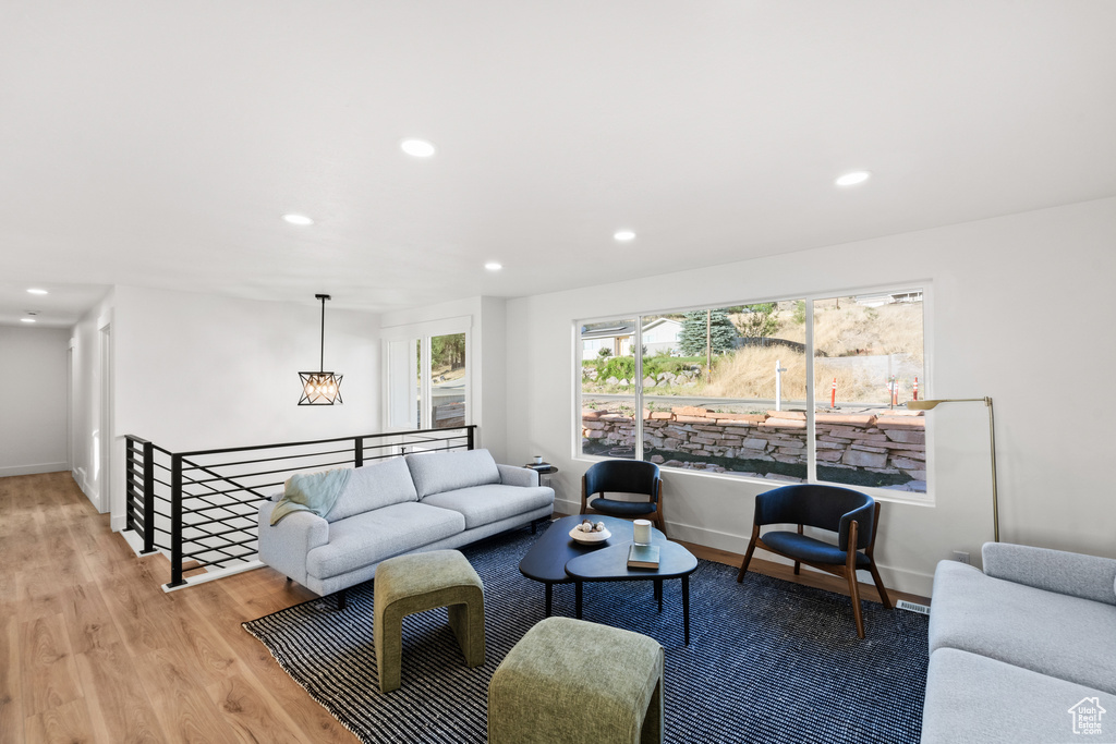 Living area featuring wood finished floors and recessed lighting