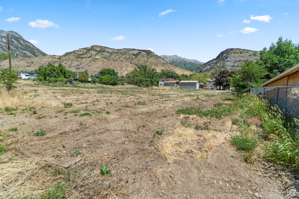 View of mountain backdrop with rural landscape
