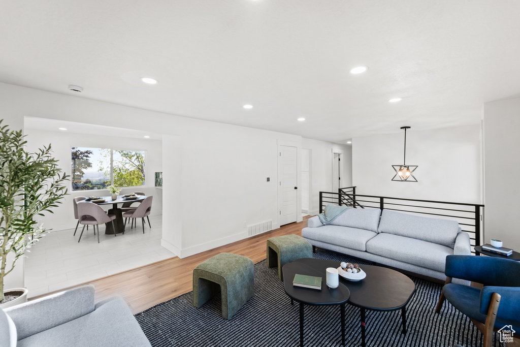 Living area featuring recessed lighting and light wood finished floors