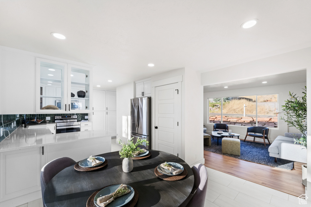 Dining space featuring recessed lighting