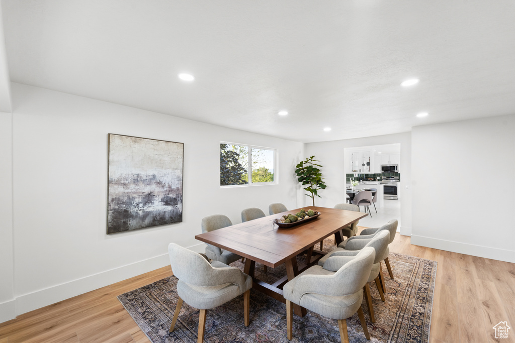 Dining room featuring recessed lighting and light wood-style floors