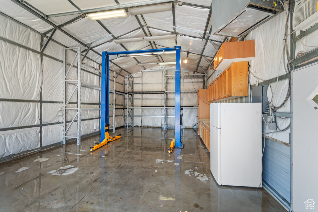 Garage with freestanding refrigerator