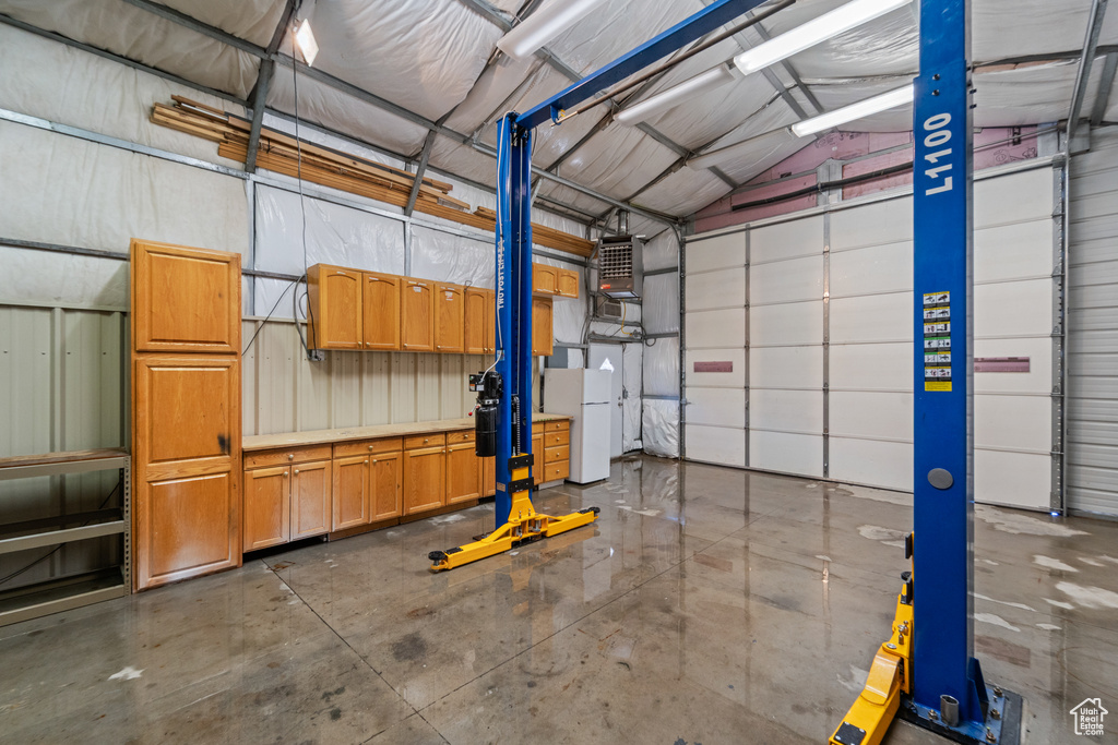 Garage with freestanding refrigerator
