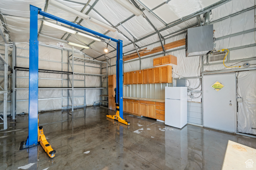 Garage with freestanding refrigerator