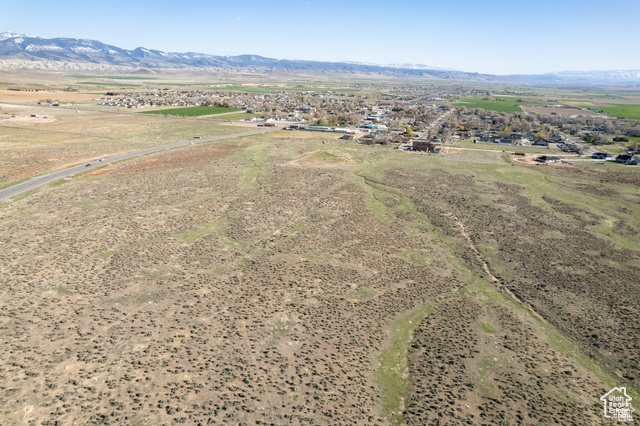Aerial view of sparsely populated area with a mountainous background