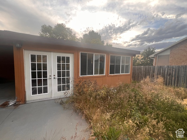View of home's exterior featuring french doors and a patio area