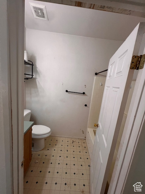 Full bathroom featuring vanity, tile patterned floors, and tub / shower combination