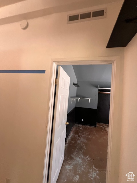 Bathroom with unfinished concrete flooring