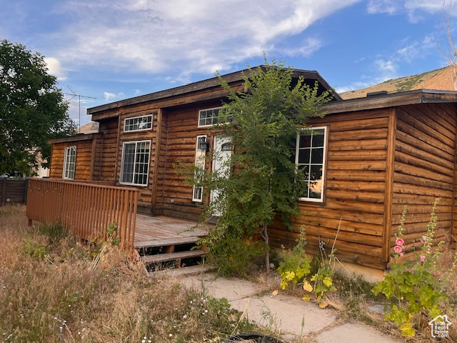 Rear view of house featuring a deck