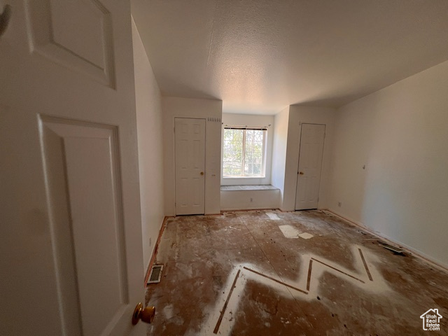 Spare room featuring a textured ceiling