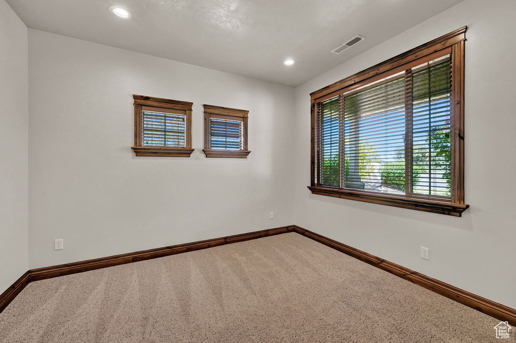 Unfurnished room featuring carpet and recessed lighting