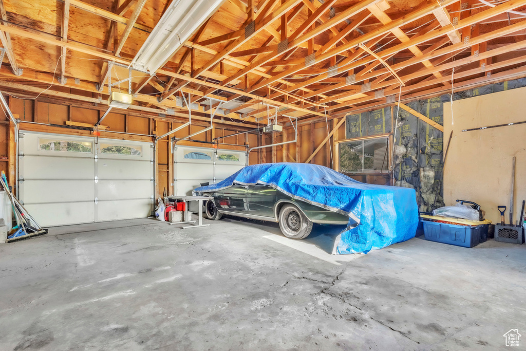 Garage featuring a garage door opener