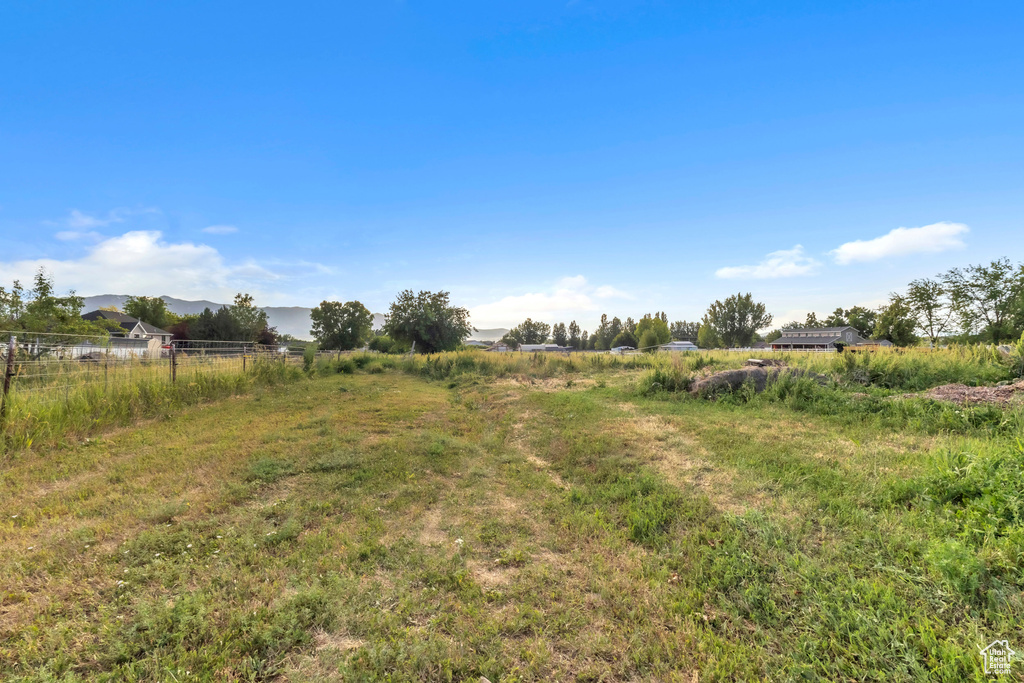 View of yard with a mountain view and a view of countryside