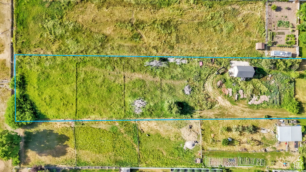 Aerial view of property and surrounding area with property boundaries highlighted